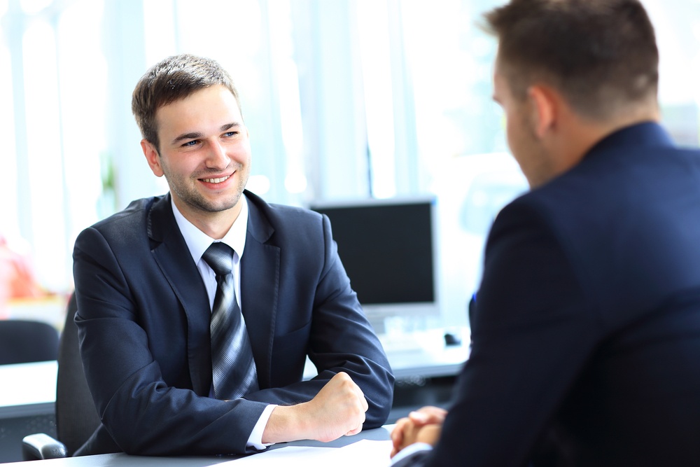 An employer interviewing a candidate for a job